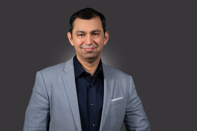 Headshot of a CEO with a clean backdrop shot by a professional photographer in Gurgaon, Delhi NCR.