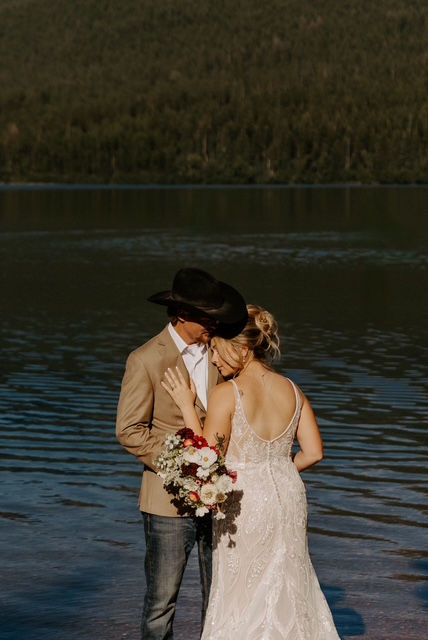 August elopement couple at Bowman Lake in Glacier Park