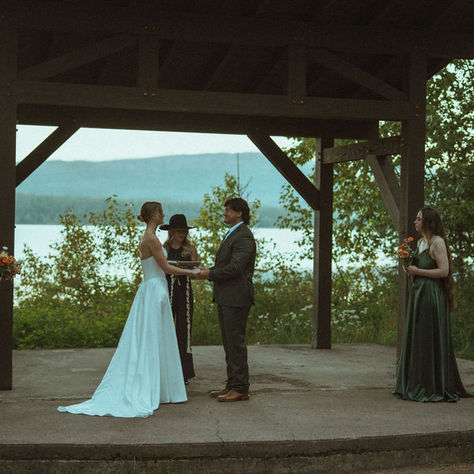 Couple exchanging vows at Apgar Amphiltheatre