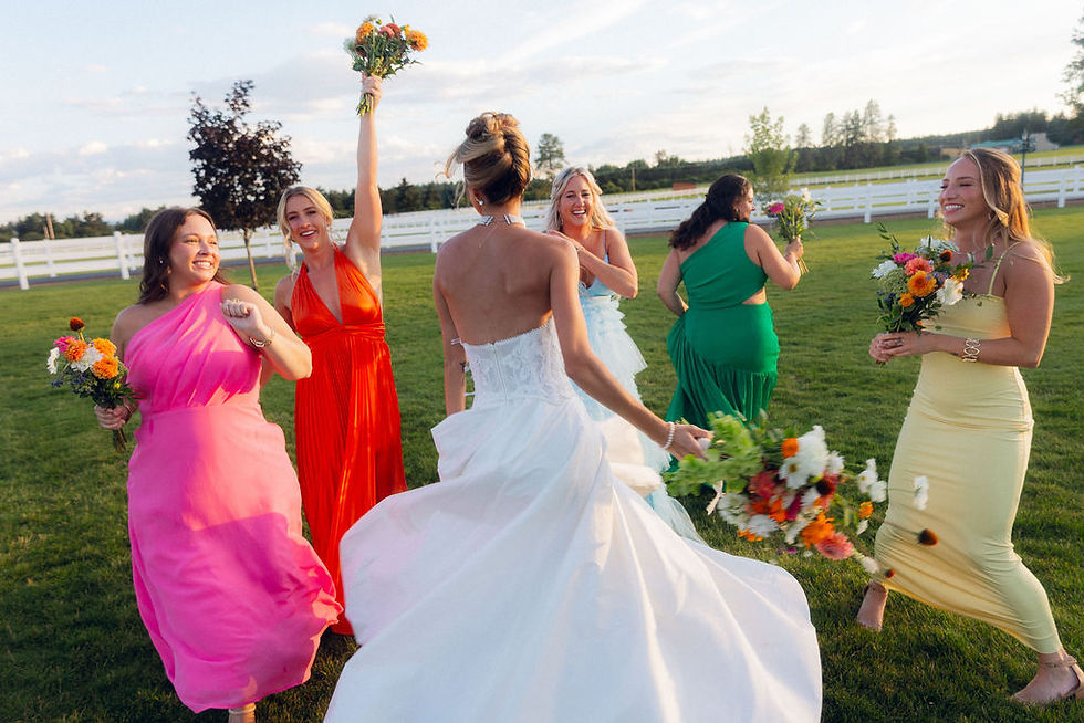 Bride with her colorful bridesmaids at a Montana wedding with florals from Two Kays Flower Farm