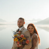 Couple eloping on the shores in Glacier Park
