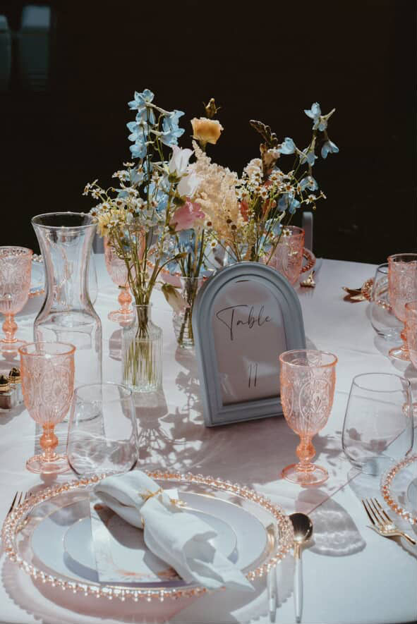 Bud vases at wedding table scape