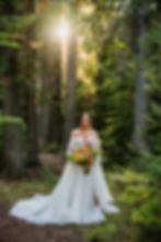 Bride in Glacier Park with a colorful bridal bouquet for her elopement