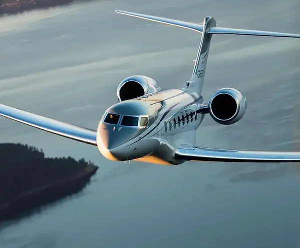 Gulfstream G650ER private jet cruising in flight above the clouds