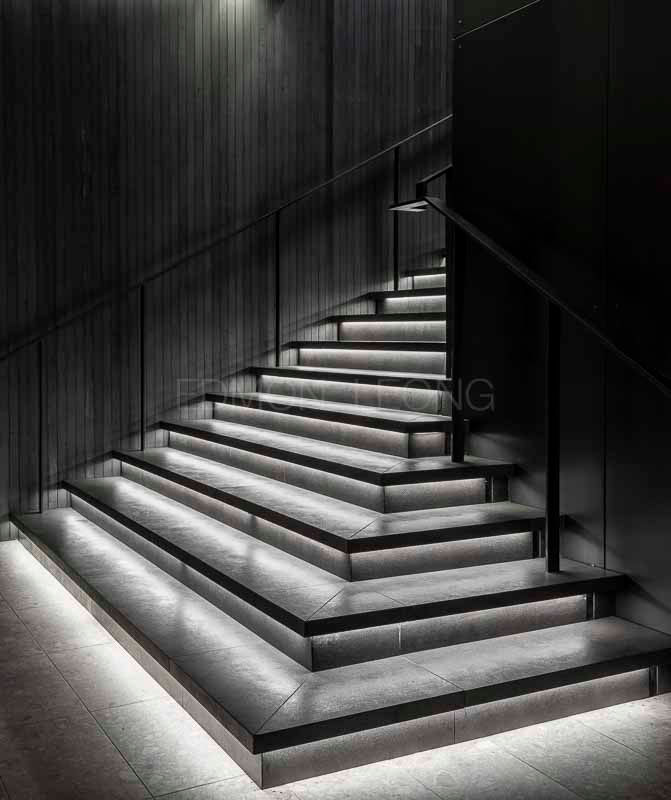 High-performance luxury hospitality interior photography of Equinox Hotel New York by Edmon Leong, highlighting dark architectural tones, sleek metallic accents, and cinematic lighting by Joyce Wang Studio.