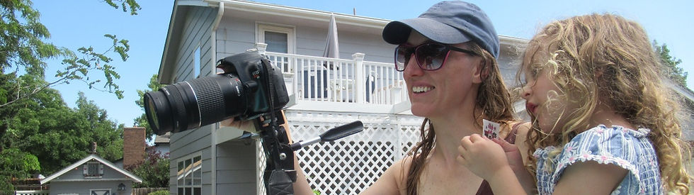 Amy sets up a shot for COMPROMISED with her daughter in her arms.