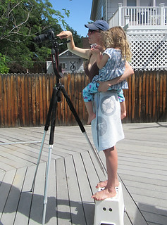 Amy Giaquinto preps a shot for her short film, COMPROMISED, with her daughter in her arms. Photo by Justin Giaquinto.