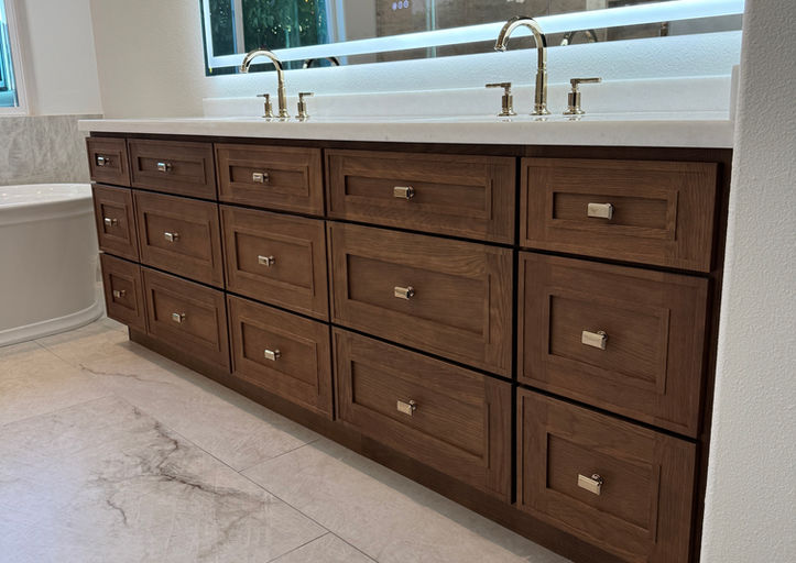 Bathroom vanity with drawers and sinks, modern design, white countertop, beautiful cabinets.