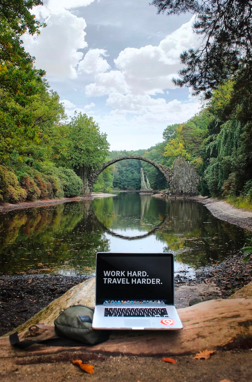 Mac laptop working remote in the forest
