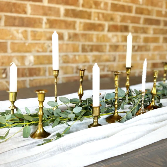 Brass candlestick and candle Rustic Rental