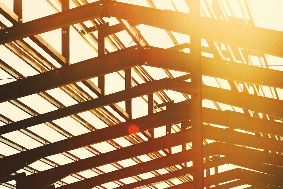 Ceiling beams at a construction site with the sunlight coming through