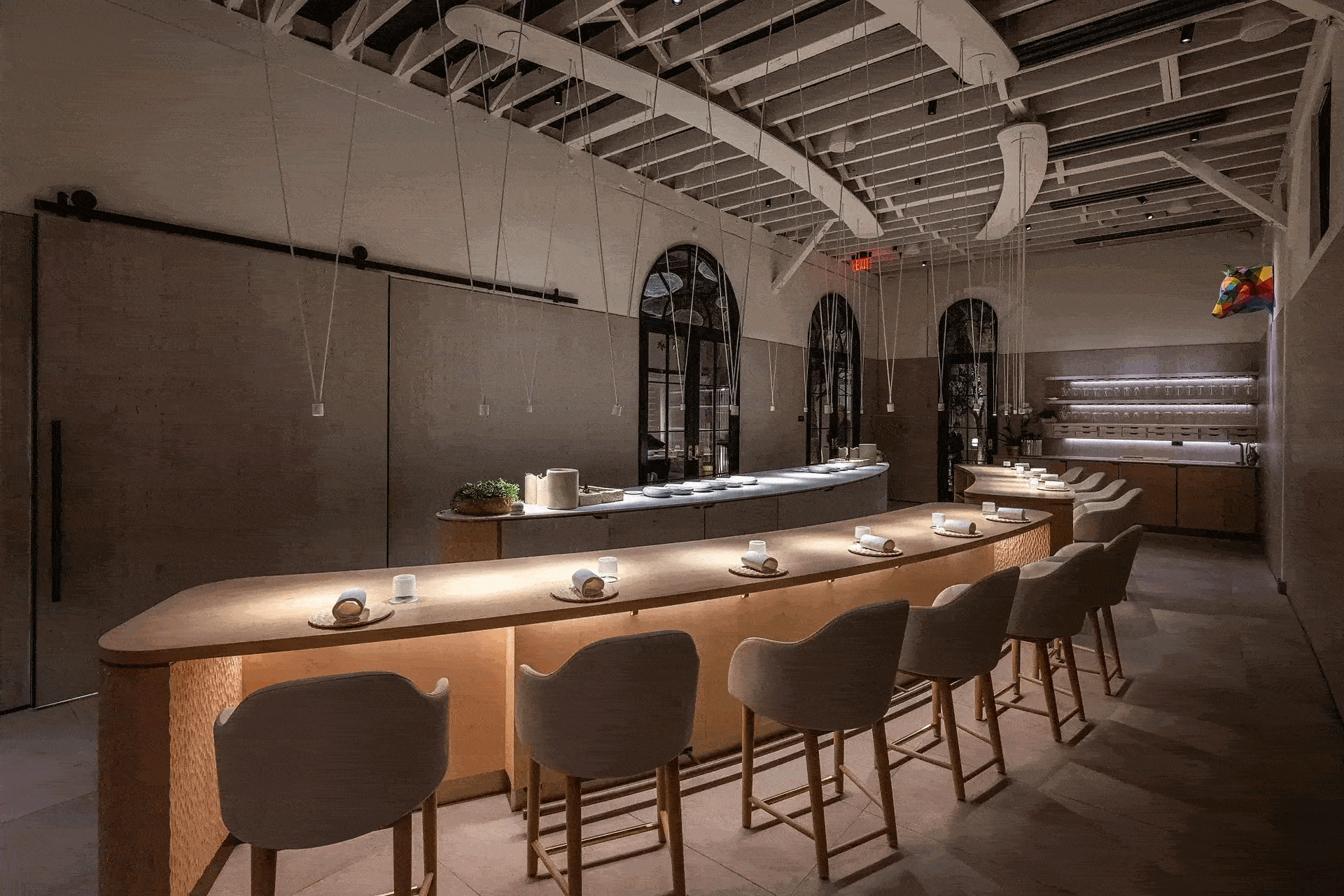 Two restaurant interiors that are dark and moody