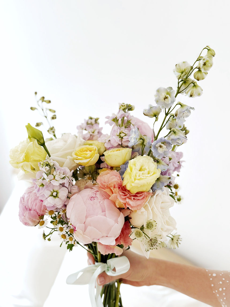 Lover’s Garden premium pastel bridal bouquet with peonies, delphiniums, matthiolas, and Ohara roses, hand-crafted fresh flowe
