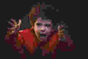 toddler with red adidas sweat shirt