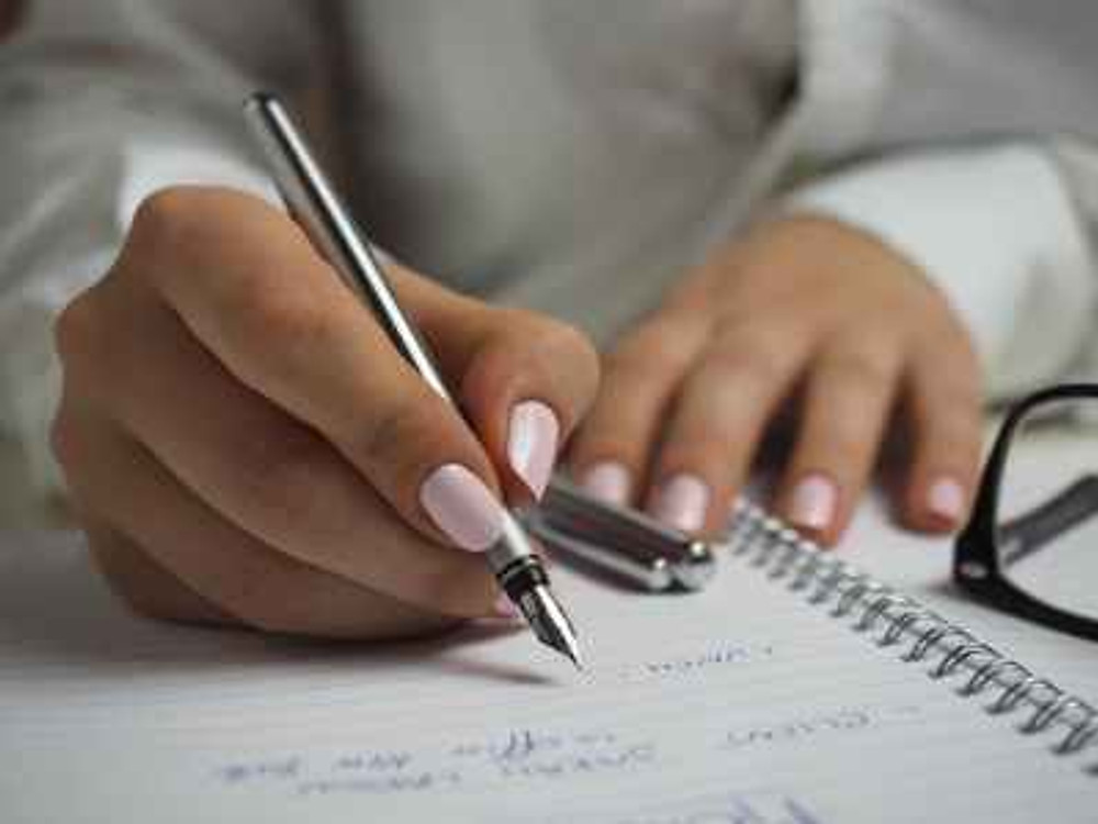 person hands woman pen