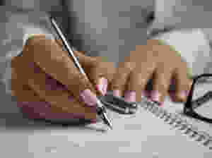 person hands woman pen