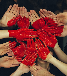 Hands forming red heart