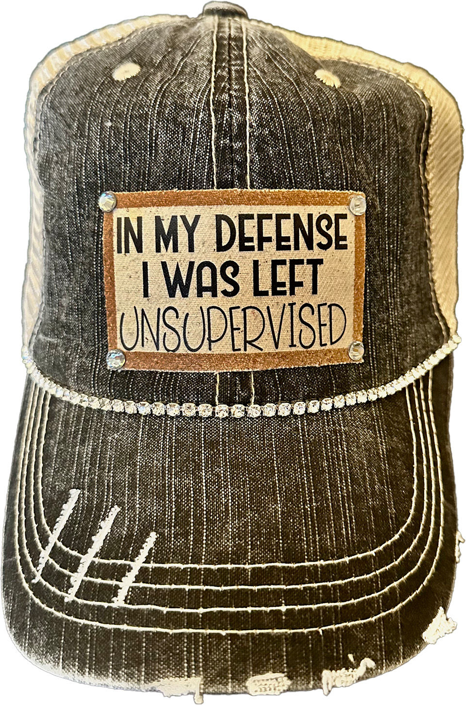 Black Distressed Black Trucker Hat with bling and a patch that says In My Defense I was left unsupervised