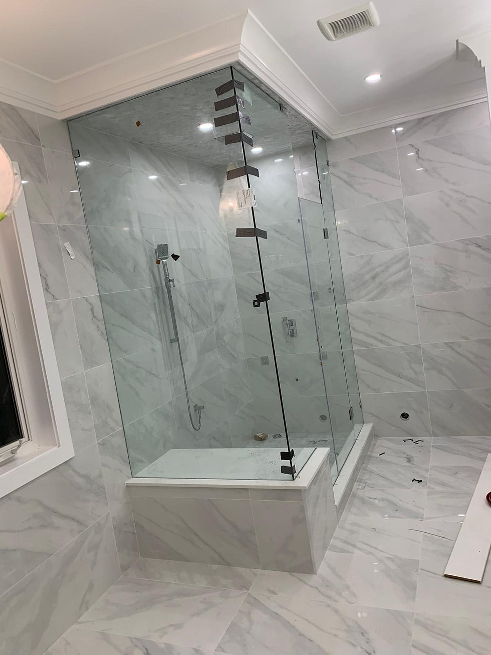 Eye-level view of a professional glass repair van parked outside a residential home