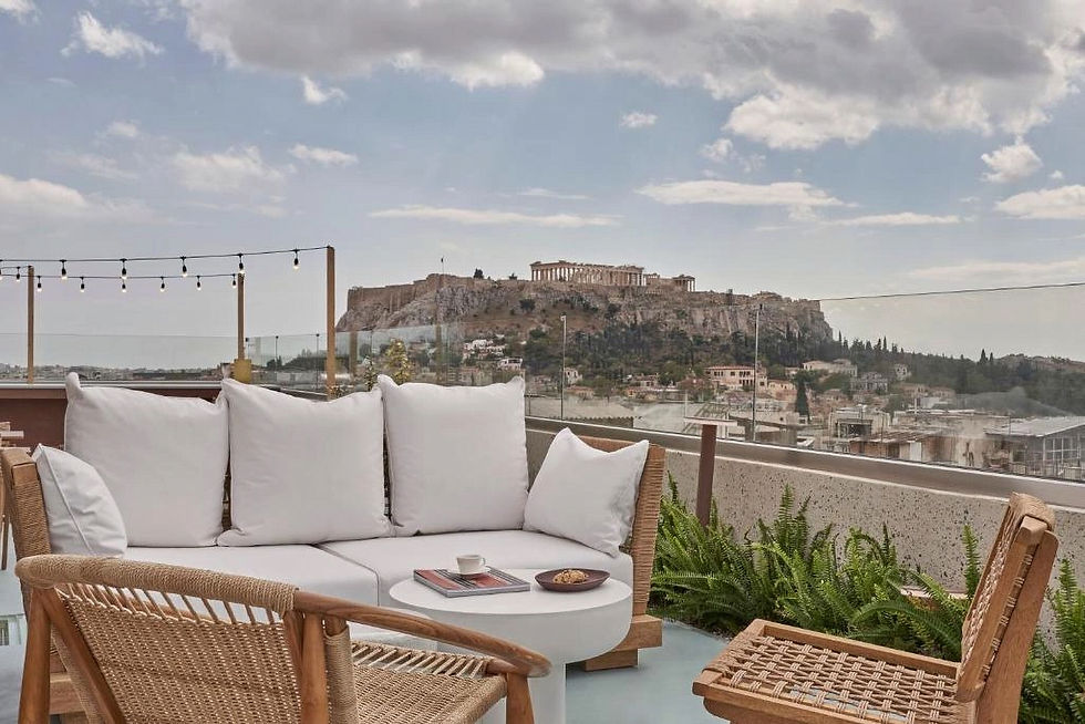 Rooftop dining at Lekka Hotel offers a stunning view of the Acropolis, with comfortable seating and a serene ambiance.