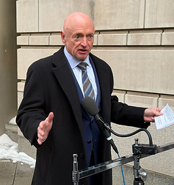 Mark-Kelly-at-courthouse-scaled_edited.p