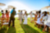 Bride and Groom walking down aisle at beach wedding ceremony