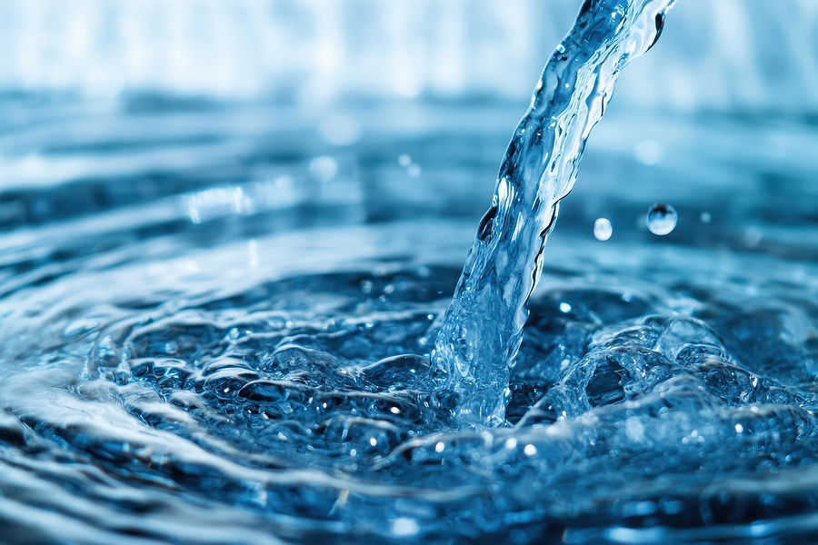 Close-up of clear, blue water being poured