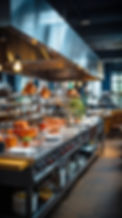 A spacious, modern restaurant kitchen with gleaming stainless steel countertops