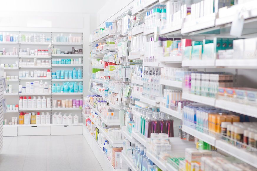 Pharmacy shelves stocked with a variety of medicines and health products, organized for easy access and selection