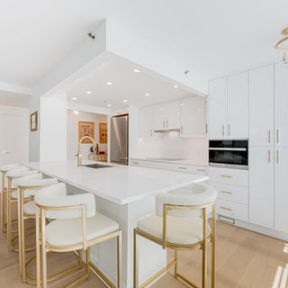 A sleek dining area with an open kitchen