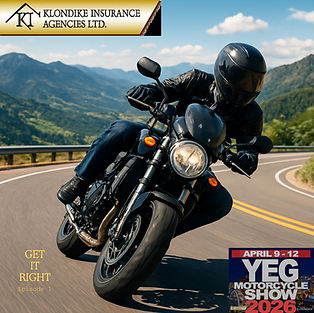 Motorcyclist in black gear leans into a sunny mountain road curve