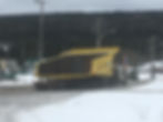 Heavy haul truck transporting oversized mining equipment on snowy road