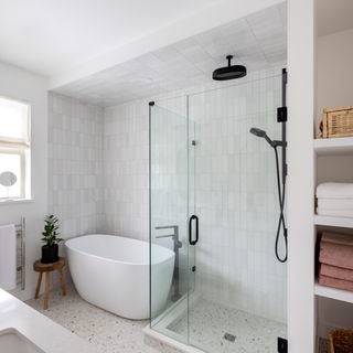 Beautiful bathroom with white bathtub and shower space