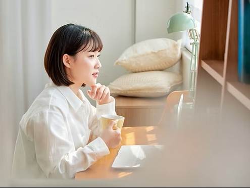 Paramedics placing a cervical collar on a woman injured in a car accident