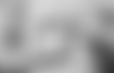 Close-up of person’s hands holding up clock emphasizing the concept of time