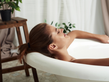 A close shot of a woman relaxing in a bathtub