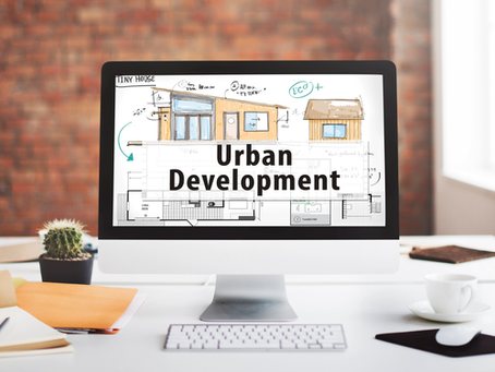 A computer with a wallpaper of urban development