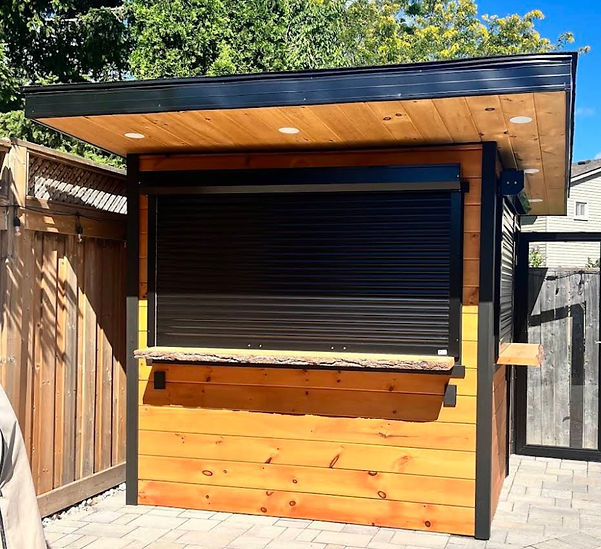 A small outdoor kitchen featuring a black roof