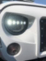 6774790Close-up of a white vehicle's front5_3065710090157970_1027380667106721792_n