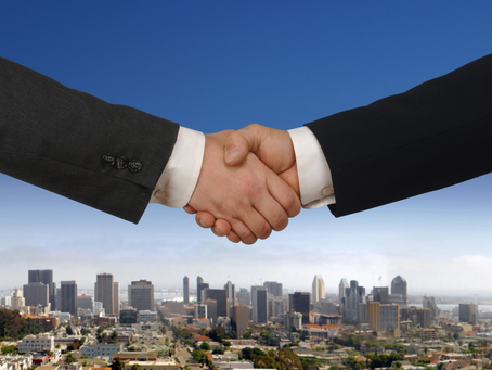 Handshake with city in the background