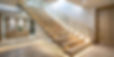 Modern wooden staircase, with elegant glass railing produced and expertly installed by Southwest Doors & Hardware.