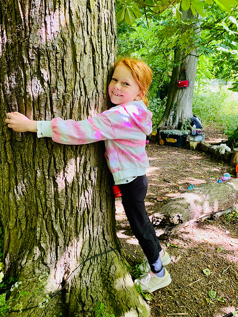 nature loving child at green planet forest school