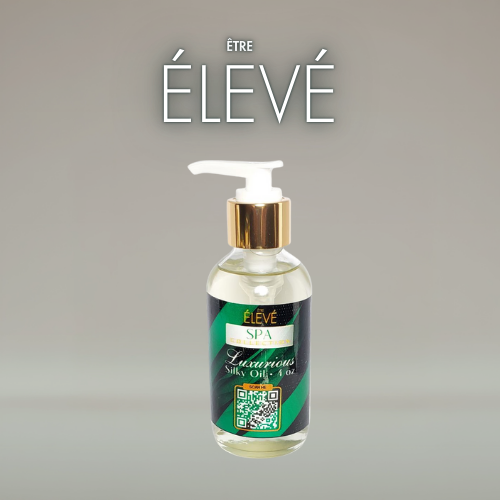 Luxury silky body oil bottle with pump from ÊTRE ÉLEVÉ Spa Collection for radiant skin