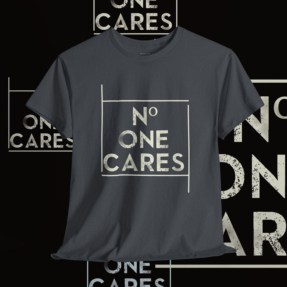 Thumbnail: Dark gray t-shirt with centered text: NO ONE CARES. indiemusictees rebel without a clue tshirt