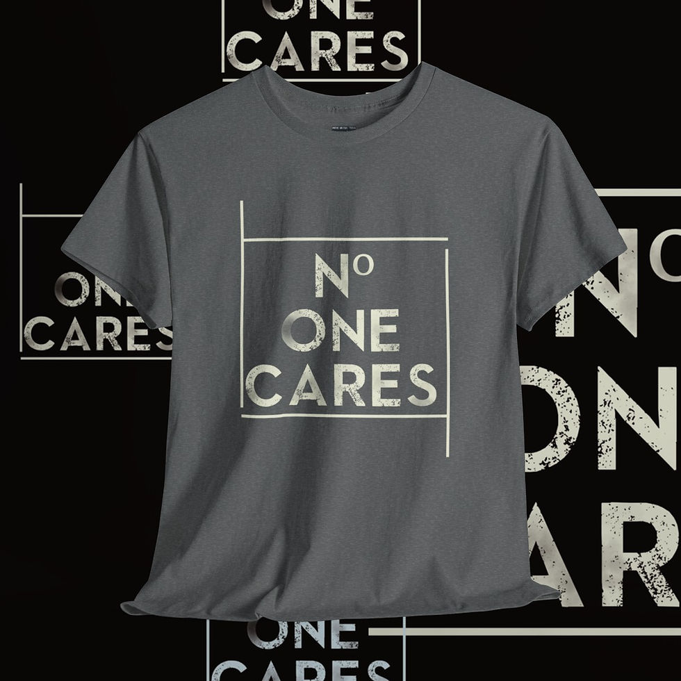 Thumbnail: Gray t-shirt with text 'No One Cares', indiemusictees apparel design.