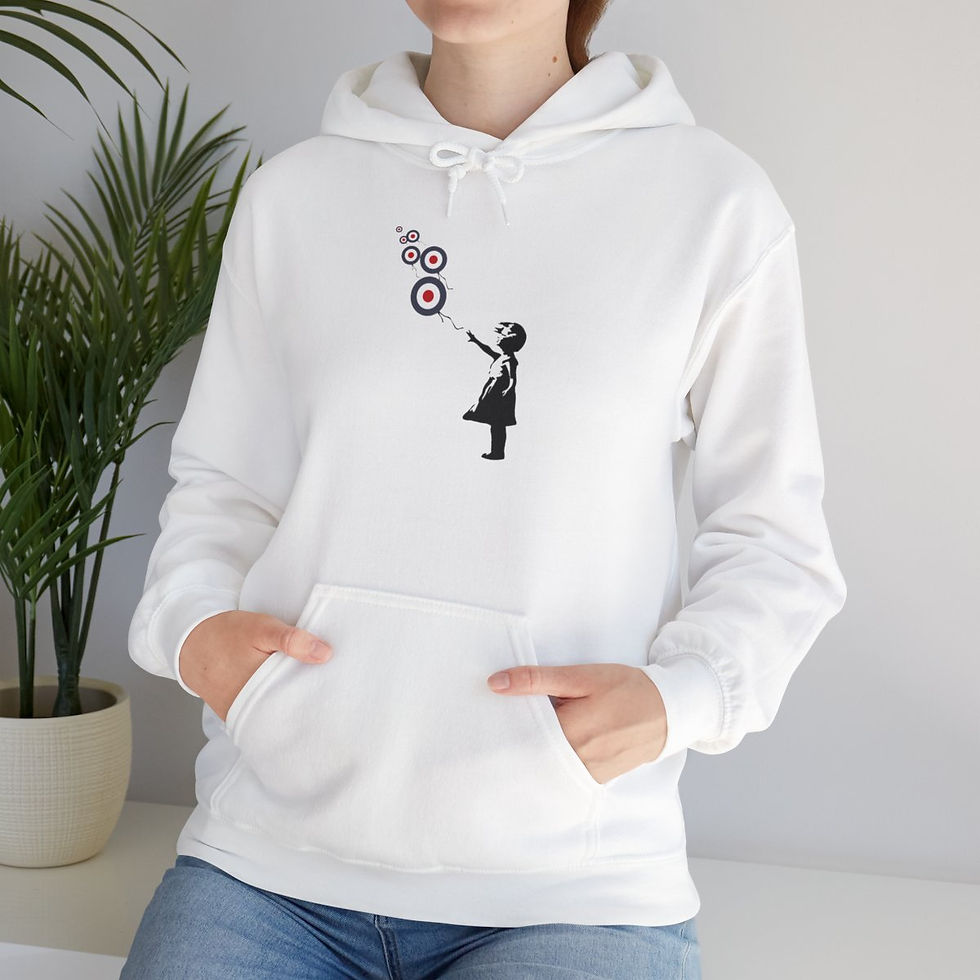Thumbnail: Woman wearing white hoodie with Banksy art, holding heart balloons, art and fashion.