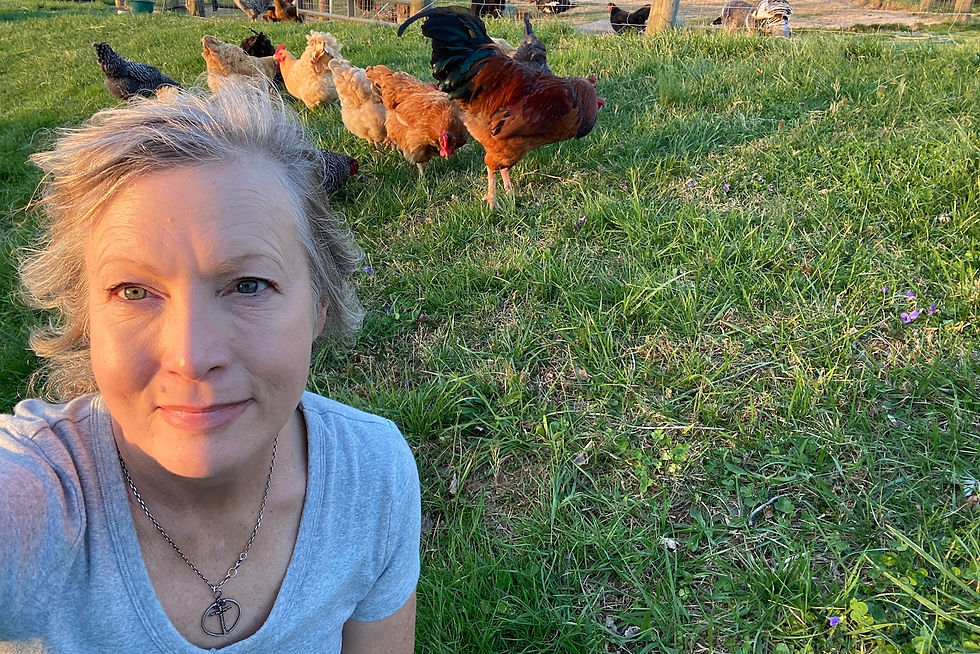 woman with backyard chickens reflecting on natural health and lifestyle changes