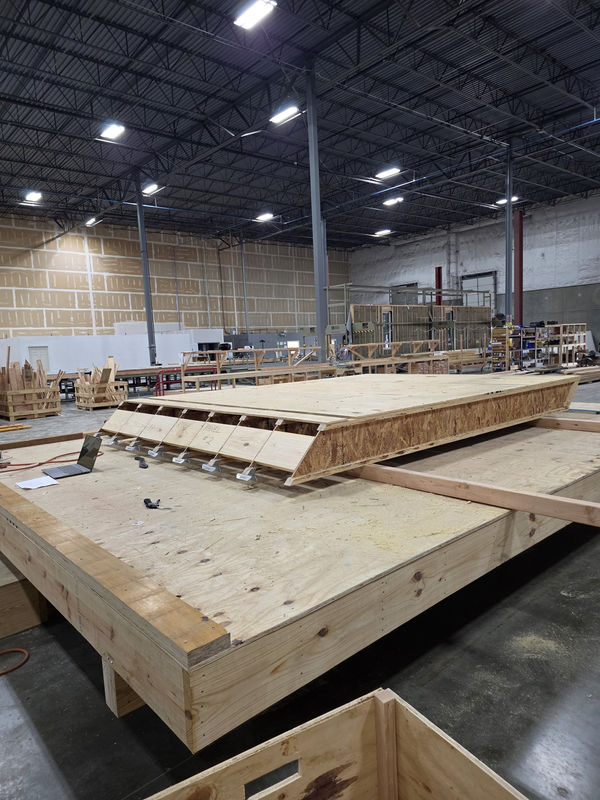A roof panel framed and sheathed on a table at the MBS plant in St. Louis, built to ship flat to the job site