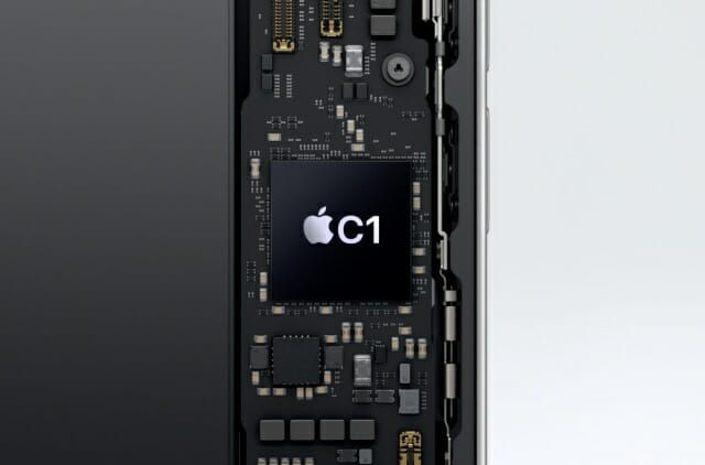 A close-up of a smartphone’s circuit board features a black chip labeled Apple C1. The background is a gradient from black to light gray.