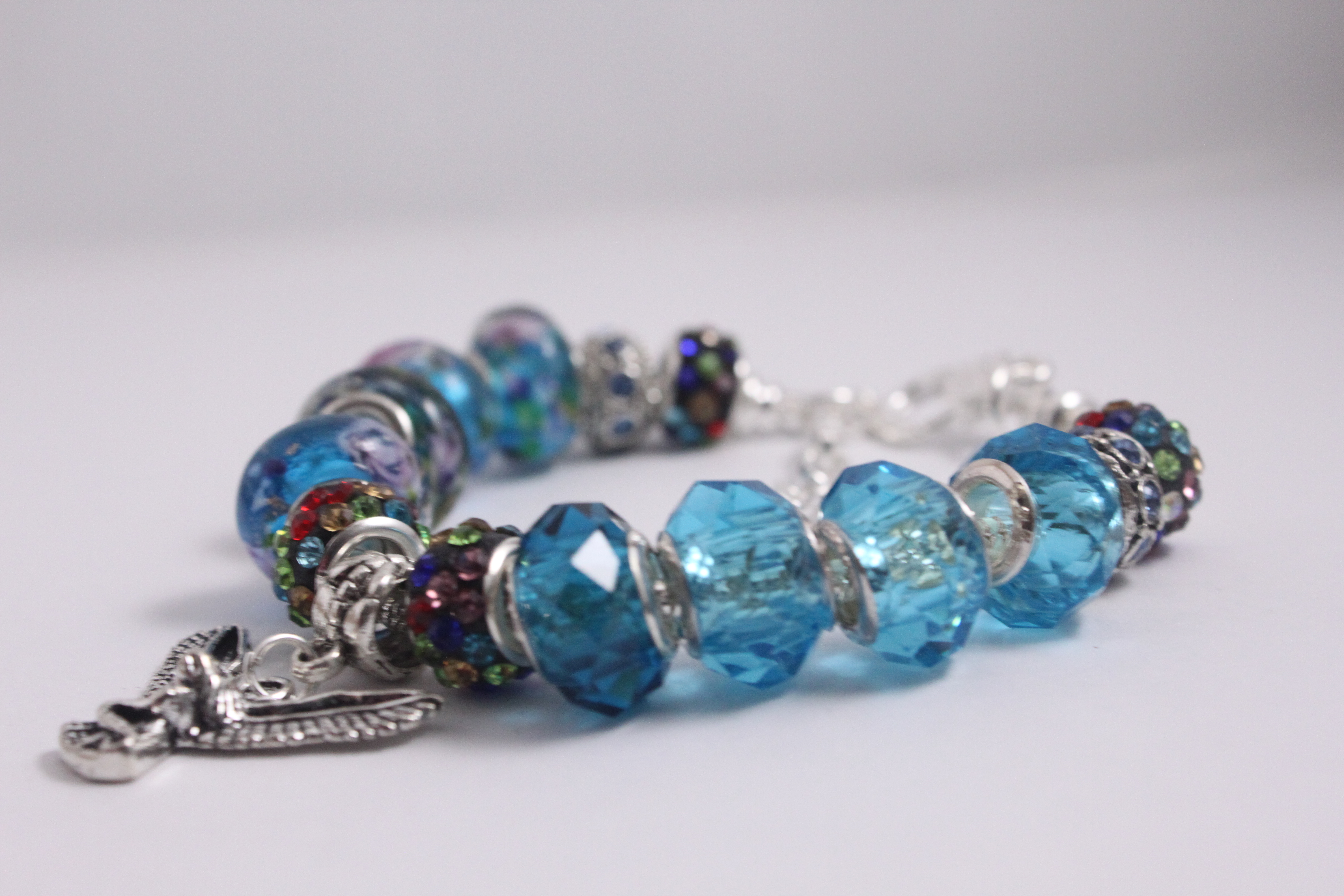 Bird charm bracelet - blue crystal